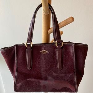 Calf hair cross body bag by Coach